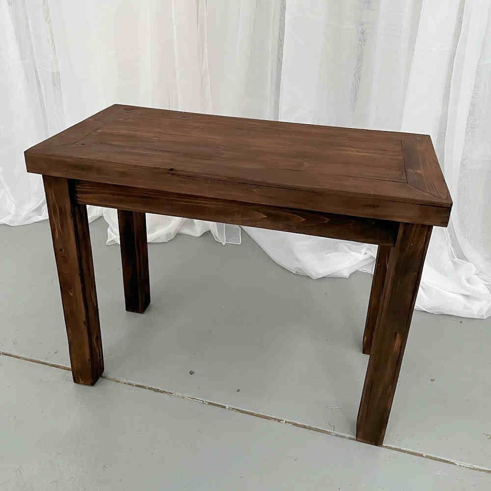 Hire DARK STAIN SMALL TIMBER TABLE, hire Tables, near Cheltenham image 1