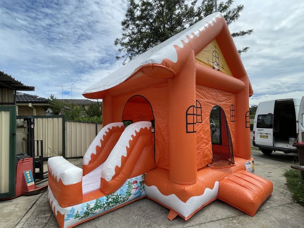 Hire SNOWING ORANGE CHRISTMAS HOUSE WITH SLIDE POP UPS AND BASKETBALL HOOP 4x4.5m, hire Jumping Castles, near Doonside