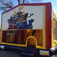 Hire SESAME STREET JUMPING CASTLE WITH SLIDE
