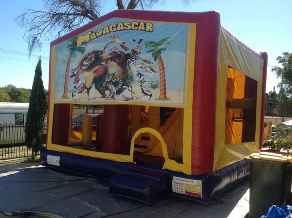 Hire MADAGASCAR JUMPING CASTLE WITH SLIDE