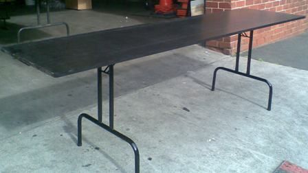 Hire Black Ply Top Folding Trestle Table, in Balaclava, VIC