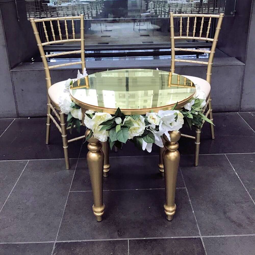 Hire GOLD ROUND TABLE WITH ACRYLIC TOP AND OPTIONAL SILK WHITE FLOWERS, hire Tables, near Cheltenham