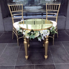Hire GOLD ROUND TABLE WITH ACRYLIC TOP AND OPTIONAL SILK WHITE FLOWERS, in Cheltenham, VIC