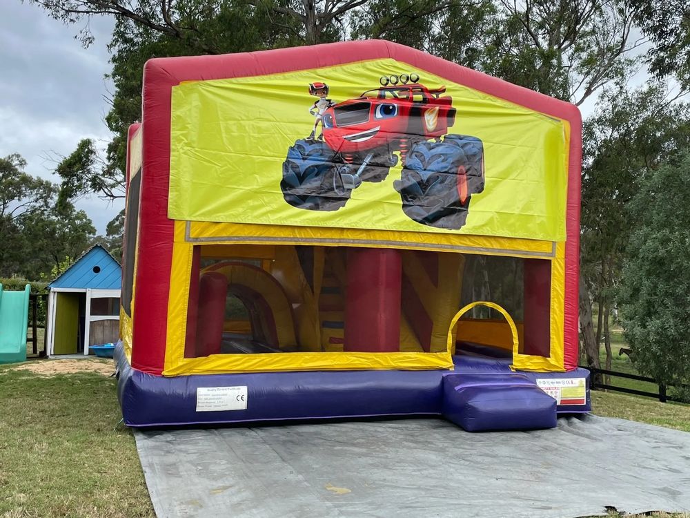 Hire BIG WHEELS JUMPING CASTLE WITH SLIDE, hire Miscellaneous, near Doonside