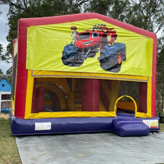 Hire BIG WHEELS JUMPING CASTLE WITH SLIDE